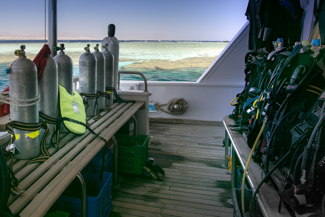 a row of scuba equipment sitting on top of a boat.
